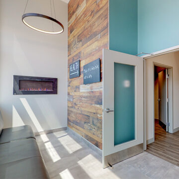 Kanata clinic waiting area with a fireplace, modern decor, and a welcoming feel.