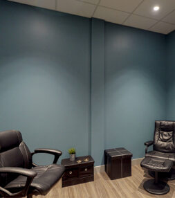 Consultation room with two comfortable reclining chairs.